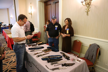 Tripp - checking out knives at Bill's table